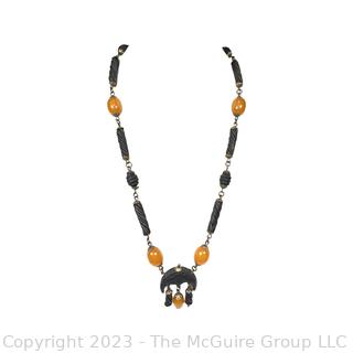 Carved Wood or Bone Tribal Bead Necklace with Amber Color Beads. 
