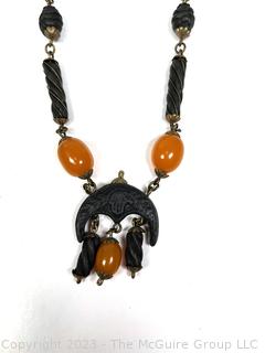 Carved Wood or Bone Tribal Bead Necklace with Amber Color Beads. 
