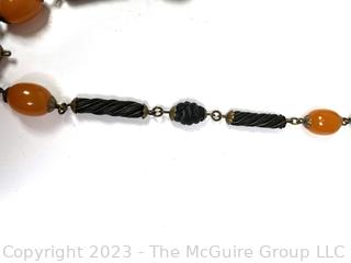 Carved Wood or Bone Tribal Bead Necklace with Amber Color Beads. 
