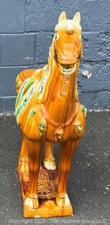 Large Chinese Tang Dynasty-Style Sancai Glazed Ceramic War Horse.  Chip in underside of base. This is the second of two being offered in this auction.  36" tall.  