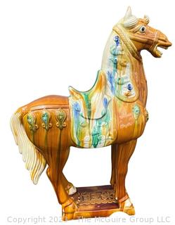 Large Chinese Tang Dynasty-Style Sancai Glazed Ceramic War Horse.  Chip in underside of base. This is the second of two being offered in this auction.  36" tall.  