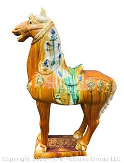 Large Chinese Tang Dynasty-Style Sancai Glazed Ceramic War Horse.  Chip in underside of base. This is the second of two being offered in this auction.  36" tall.  