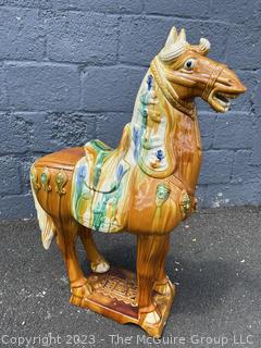 Large Chinese Tang Dynasty-Style Sancai Glazed Ceramic War Horse.  Chip in underside of base. This is the second of two being offered in this auction.  36" tall.  