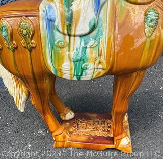 Large Chinese Tang Dynasty-Style Sancai Glazed Ceramic War Horse.  Chip in underside of base. This is the second of two being offered in this auction.  36" tall.  