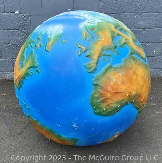 Large Painted Fiberglass World Globe with Hanging Wire.  Some dents and cracks. 47" diameter. 