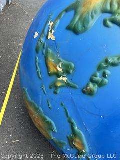 Large Painted Fiberglass World Globe with Hanging Wire.  Some dents and cracks. 47" diameter. 