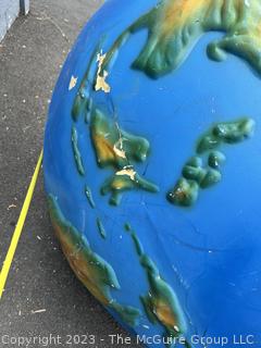 Large Painted Fiberglass World Globe with Hanging Wire.  Some dents and cracks. 47" diameter. 