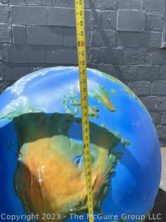 Large Painted Fiberglass World Globe with Hanging Wire.  Some dents and cracks. 47" diameter. 