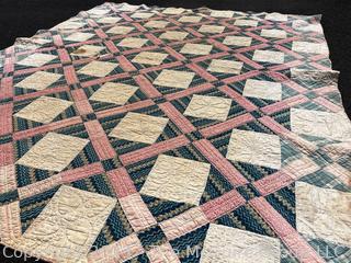 Vintage Hand Stitched Flour Sack Quilt in the Foundry Pattern. Some staining. Measures 86" x 72".