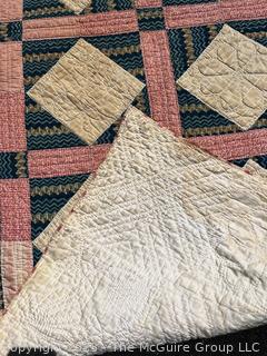 Vintage Hand Stitched Flour Sack Quilt in the Foundry Pattern. Some staining. Measures 86" x 72".