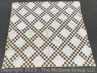 Vintage Hand Stitched Flour Sack Quilt in the  Double Irish Chain Pattern. Some staining. Measures 79" x 72".