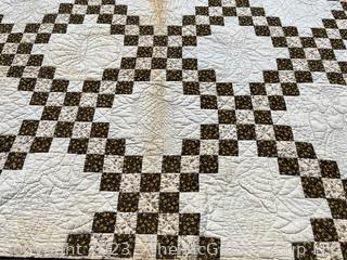 Vintage Hand Stitched Flour Sack Quilt in the  Double Irish Chain Pattern. Some staining. Measures 79" x 72".