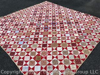 Vintage Hand Stitched Flour Sack Quilt in the Hour Glass Chain Pattern. Some staining. Measures 83" x 77".