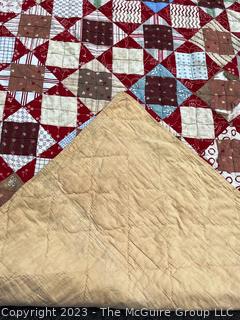 Vintage Hand Stitched Flour Sack Quilt in the Hour Glass Chain Pattern. Some staining. Measures 83" x 77".