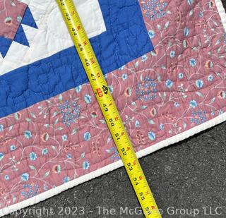 Small Babys Quilt in Pink and Blue made by Quilts Unlimited,  40" x 53".