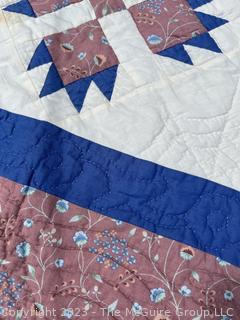 Small Babys Quilt in Pink and Blue made by Quilts Unlimited,  40" x 53".