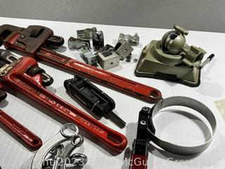 Group of Tools Including Pipe Wrenches and PanaVise 