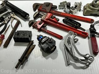 Group of Tools Including Pipe Wrenches and PanaVise 