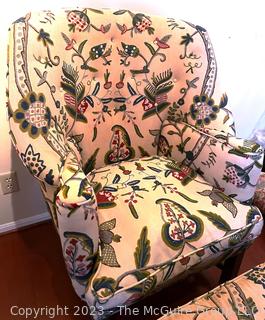 Queen Anne Wing Back Chair and Matching Ottoman Upholstered in Crewel Embroidery on White Ground.  