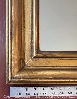 Large Gilt Framed Wall Mirror. Measures 36 x 61"