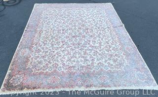 Karastan Kirman Wool Area Rug.  Some discoloration due to sun. Measures 11' x 14'