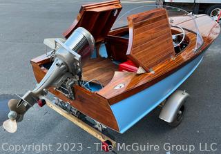 14' Restored 1952 Chris-Craft Classic Wooden Kit Runabout Boat With 1957 Mercury Mark 55E Outboard Motor And Mastercraft Trailer. According to consignor, "Winner of the Prestigious Best Outboard Boat Award at the 26th annual Antique and Classic Boat Society Chesapeake Bay Chapter Antique and Classic Boat Festival 2014. Originally assembled by Norman W. Bailey of Newmarket N.J., the boat has been renovated with expert craftsmanship and the finest materials and hardware available.  Stripped the the hull bare, replaced with Sepele Mahogany. All original wood sealed with CPES epoxy (inside and out) and joints secured with West Systems. Sikaflex adhesive sealant caulk on deck to match wood color. 3 coats of Pettit - Bikini Blue on hull and 7 coats of Z-Spar on deck. Matching exterior grade latex paint on hull interior to help wood breath and dampness evaporate. Flush cleats and electrical switching by Attwood and Cole Hersee Co.-U.S.A.. (see more below)