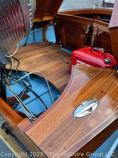 14' Restored 1952 Chris-Craft Classic Wooden Kit Runabout Boat With 1957 Mercury Mark 55E Outboard Motor And Mastercraft Trailer. According to consignor, "Winner of the Prestigious Best Outboard Boat Award at the 26th annual Antique and Classic Boat Society Chesapeake Bay Chapter Antique and Classic Boat Festival 2014. Originally assembled by Norman W. Bailey of Newmarket N.J., the boat has been renovated with expert craftsmanship and the finest materials and hardware available.  Stripped the the hull bare, replaced with Sepele Mahogany. All original wood sealed with CPES epoxy (inside and out) and joints secured with West Systems. Sikaflex adhesive sealant caulk on deck to match wood color. 3 coats of Pettit - Bikini Blue on hull and 7 coats of Z-Spar on deck. Matching exterior grade latex paint on hull interior to help wood breath and dampness evaporate. Flush cleats and electrical switching by Attwood and Cole Hersee Co.-U.S.A.. (see more below)