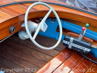 14' Restored 1952 Chris-Craft Classic Wooden Kit Runabout Boat With 1957 Mercury Mark 55E Outboard Motor And Mastercraft Trailer. According to consignor, "Winner of the Prestigious Best Outboard Boat Award at the 26th annual Antique and Classic Boat Society Chesapeake Bay Chapter Antique and Classic Boat Festival 2014. Originally assembled by Norman W. Bailey of Newmarket N.J., the boat has been renovated with expert craftsmanship and the finest materials and hardware available.  Stripped the the hull bare, replaced with Sepele Mahogany. All original wood sealed with CPES epoxy (inside and out) and joints secured with West Systems. Sikaflex adhesive sealant caulk on deck to match wood color. 3 coats of Pettit - Bikini Blue on hull and 7 coats of Z-Spar on deck. Matching exterior grade latex paint on hull interior to help wood breath and dampness evaporate. Flush cleats and electrical switching by Attwood and Cole Hersee Co.-U.S.A.. (see more below)