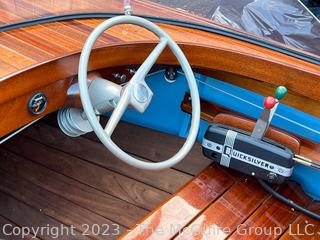 14' Restored 1952 Chris-Craft Classic Wooden Kit Runabout Boat With 1957 Mercury Mark 55E Outboard Motor And Mastercraft Trailer. According to consignor, "Winner of the Prestigious Best Outboard Boat Award at the 26th annual Antique and Classic Boat Society Chesapeake Bay Chapter Antique and Classic Boat Festival 2014. Originally assembled by Norman W. Bailey of Newmarket N.J., the boat has been renovated with expert craftsmanship and the finest materials and hardware available.  Stripped the the hull bare, replaced with Sepele Mahogany. All original wood sealed with CPES epoxy (inside and out) and joints secured with West Systems. Sikaflex adhesive sealant caulk on deck to match wood color. 3 coats of Pettit - Bikini Blue on hull and 7 coats of Z-Spar on deck. Matching exterior grade latex paint on hull interior to help wood breath and dampness evaporate. Flush cleats and electrical switching by Attwood and Cole Hersee Co.-U.S.A.. (see more below)