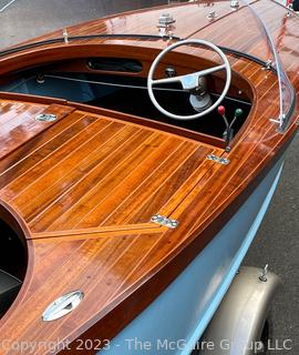 14' Restored 1952 Chris-Craft Classic Wooden Kit Runabout Boat With 1957 Mercury Mark 55E Outboard Motor And Mastercraft Trailer. According to consignor, "Winner of the Prestigious Best Outboard Boat Award at the 26th annual Antique and Classic Boat Society Chesapeake Bay Chapter Antique and Classic Boat Festival 2014. Originally assembled by Norman W. Bailey of Newmarket N.J., the boat has been renovated with expert craftsmanship and the finest materials and hardware available.  Stripped the the hull bare, replaced with Sepele Mahogany. All original wood sealed with CPES epoxy (inside and out) and joints secured with West Systems. Sikaflex adhesive sealant caulk on deck to match wood color. 3 coats of Pettit - Bikini Blue on hull and 7 coats of Z-Spar on deck. Matching exterior grade latex paint on hull interior to help wood breath and dampness evaporate. Flush cleats and electrical switching by Attwood and Cole Hersee Co.-U.S.A.. (see more below)