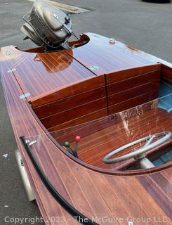 14' Restored 1952 Chris-Craft Classic Wooden Kit Runabout Boat With 1957 Mercury Mark 55E Outboard Motor And Mastercraft Trailer. According to consignor, "Winner of the Prestigious Best Outboard Boat Award at the 26th annual Antique and Classic Boat Society Chesapeake Bay Chapter Antique and Classic Boat Festival 2014. Originally assembled by Norman W. Bailey of Newmarket N.J., the boat has been renovated with expert craftsmanship and the finest materials and hardware available.  Stripped the the hull bare, replaced with Sepele Mahogany. All original wood sealed with CPES epoxy (inside and out) and joints secured with West Systems. Sikaflex adhesive sealant caulk on deck to match wood color. 3 coats of Pettit - Bikini Blue on hull and 7 coats of Z-Spar on deck. Matching exterior grade latex paint on hull interior to help wood breath and dampness evaporate. Flush cleats and electrical switching by Attwood and Cole Hersee Co.-U.S.A.. (see more below)