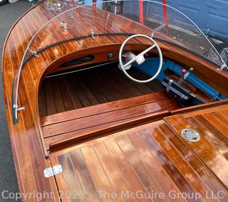 14' Restored 1952 Chris-Craft Classic Wooden Kit Runabout Boat With 1957 Mercury Mark 55E Outboard Motor And Mastercraft Trailer. According to consignor, "Winner of the Prestigious Best Outboard Boat Award at the 26th annual Antique and Classic Boat Society Chesapeake Bay Chapter Antique and Classic Boat Festival 2014. Originally assembled by Norman W. Bailey of Newmarket N.J., the boat has been renovated with expert craftsmanship and the finest materials and hardware available.  Stripped the the hull bare, replaced with Sepele Mahogany. All original wood sealed with CPES epoxy (inside and out) and joints secured with West Systems. Sikaflex adhesive sealant caulk on deck to match wood color. 3 coats of Pettit - Bikini Blue on hull and 7 coats of Z-Spar on deck. Matching exterior grade latex paint on hull interior to help wood breath and dampness evaporate. Flush cleats and electrical switching by Attwood and Cole Hersee Co.-U.S.A.. (see more below)