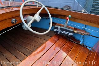 14' Restored 1952 Chris-Craft Classic Wooden Kit Runabout Boat With 1957 Mercury Mark 55E Outboard Motor And Mastercraft Trailer. According to consignor, "Winner of the Prestigious Best Outboard Boat Award at the 26th annual Antique and Classic Boat Society Chesapeake Bay Chapter Antique and Classic Boat Festival 2014. Originally assembled by Norman W. Bailey of Newmarket N.J., the boat has been renovated with expert craftsmanship and the finest materials and hardware available.  Stripped the the hull bare, replaced with Sepele Mahogany. All original wood sealed with CPES epoxy (inside and out) and joints secured with West Systems. Sikaflex adhesive sealant caulk on deck to match wood color. 3 coats of Pettit - Bikini Blue on hull and 7 coats of Z-Spar on deck. Matching exterior grade latex paint on hull interior to help wood breath and dampness evaporate. Flush cleats and electrical switching by Attwood and Cole Hersee Co.-U.S.A.. (see more below)