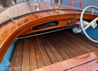 14' Restored 1952 Chris-Craft Classic Wooden Kit Runabout Boat With 1957 Mercury Mark 55E Outboard Motor And Mastercraft Trailer. According to consignor, "Winner of the Prestigious Best Outboard Boat Award at the 26th annual Antique and Classic Boat Society Chesapeake Bay Chapter Antique and Classic Boat Festival 2014. Originally assembled by Norman W. Bailey of Newmarket N.J., the boat has been renovated with expert craftsmanship and the finest materials and hardware available.  Stripped the the hull bare, replaced with Sepele Mahogany. All original wood sealed with CPES epoxy (inside and out) and joints secured with West Systems. Sikaflex adhesive sealant caulk on deck to match wood color. 3 coats of Pettit - Bikini Blue on hull and 7 coats of Z-Spar on deck. Matching exterior grade latex paint on hull interior to help wood breath and dampness evaporate. Flush cleats and electrical switching by Attwood and Cole Hersee Co.-U.S.A.. (see more below)