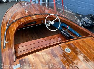 14' Restored 1952 Chris-Craft Classic Wooden Kit Runabout Boat With 1957 Mercury Mark 55E Outboard Motor And Mastercraft Trailer. According to consignor, "Winner of the Prestigious Best Outboard Boat Award at the 26th annual Antique and Classic Boat Society Chesapeake Bay Chapter Antique and Classic Boat Festival 2014. Originally assembled by Norman W. Bailey of Newmarket N.J., the boat has been renovated with expert craftsmanship and the finest materials and hardware available.  Stripped the the hull bare, replaced with Sepele Mahogany. All original wood sealed with CPES epoxy (inside and out) and joints secured with West Systems. Sikaflex adhesive sealant caulk on deck to match wood color. 3 coats of Pettit - Bikini Blue on hull and 7 coats of Z-Spar on deck. Matching exterior grade latex paint on hull interior to help wood breath and dampness evaporate. Flush cleats and electrical switching by Attwood and Cole Hersee Co.-U.S.A.. (see more below)