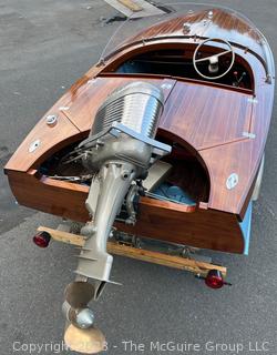 14' Restored 1952 Chris-Craft Classic Wooden Kit Runabout Boat With 1957 Mercury Mark 55E Outboard Motor And Mastercraft Trailer. According to consignor, "Winner of the Prestigious Best Outboard Boat Award at the 26th annual Antique and Classic Boat Society Chesapeake Bay Chapter Antique and Classic Boat Festival 2014. Originally assembled by Norman W. Bailey of Newmarket N.J., the boat has been renovated with expert craftsmanship and the finest materials and hardware available.  Stripped the the hull bare, replaced with Sepele Mahogany. All original wood sealed with CPES epoxy (inside and out) and joints secured with West Systems. Sikaflex adhesive sealant caulk on deck to match wood color. 3 coats of Pettit - Bikini Blue on hull and 7 coats of Z-Spar on deck. Matching exterior grade latex paint on hull interior to help wood breath and dampness evaporate. Flush cleats and electrical switching by Attwood and Cole Hersee Co.-U.S.A.. (see more below)