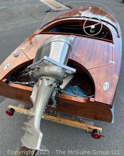 14' Restored 1952 Chris-Craft Classic Wooden Kit Runabout Boat With 1957 Mercury Mark 55E Outboard Motor And Mastercraft Trailer. According to consignor, "Winner of the Prestigious Best Outboard Boat Award at the 26th annual Antique and Classic Boat Society Chesapeake Bay Chapter Antique and Classic Boat Festival 2014. Originally assembled by Norman W. Bailey of Newmarket N.J., the boat has been renovated with expert craftsmanship and the finest materials and hardware available.  Stripped the the hull bare, replaced with Sepele Mahogany. All original wood sealed with CPES epoxy (inside and out) and joints secured with West Systems. Sikaflex adhesive sealant caulk on deck to match wood color. 3 coats of Pettit - Bikini Blue on hull and 7 coats of Z-Spar on deck. Matching exterior grade latex paint on hull interior to help wood breath and dampness evaporate. Flush cleats and electrical switching by Attwood and Cole Hersee Co.-U.S.A.. (see more below)