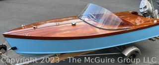 14' Restored 1952 Chris-Craft Classic Wooden Kit Runabout Boat With 1957 Mercury Mark 55E Outboard Motor And Mastercraft Trailer. According to consignor, "Winner of the Prestigious Best Outboard Boat Award at the 26th annual Antique and Classic Boat Society Chesapeake Bay Chapter Antique and Classic Boat Festival 2014. Originally assembled by Norman W. Bailey of Newmarket N.J., the boat has been renovated with expert craftsmanship and the finest materials and hardware available.  Stripped the the hull bare, replaced with Sepele Mahogany. All original wood sealed with CPES epoxy (inside and out) and joints secured with West Systems. Sikaflex adhesive sealant caulk on deck to match wood color. 3 coats of Pettit - Bikini Blue on hull and 7 coats of Z-Spar on deck. Matching exterior grade latex paint on hull interior to help wood breath and dampness evaporate. Flush cleats and electrical switching by Attwood and Cole Hersee Co.-U.S.A.. (see more below)