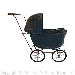 Antique Wicker Doll Buggy. Measures 21w x 11d x 22"h