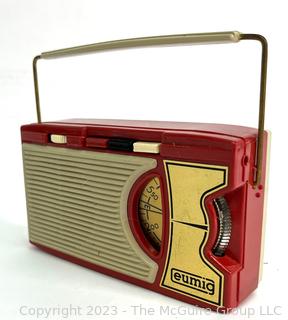 Red Eumig (Electricity and Metallwaren-Industrie-Gesellschaft) Transistor Radio, Made in Vienna. Measures 3 x 6"