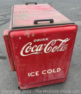 Drink Coca-Cola Large Flip Top Beverage Ice Box Cooler on Wheels.  Motor and compressor have been removed.  26" x 36" x 40"