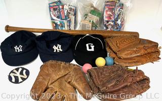 Collection of Vintage Baseball Items Including Gloves, Baseball Cards, Bat and Hats. 