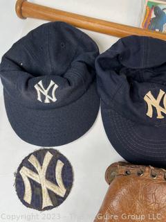 Collection of Vintage Baseball Items Including Gloves, Baseball Cards, Bat and Hats. 