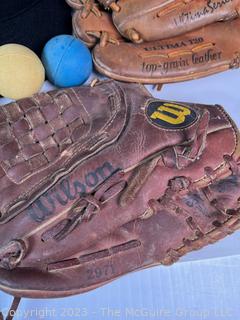 Collection of Vintage Baseball Items Including Gloves, Baseball Cards, Bat and Hats. 