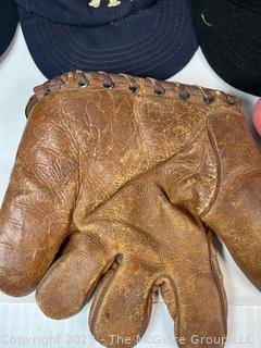 Collection of Vintage Baseball Items Including Gloves, Baseball Cards, Bat and Hats. 