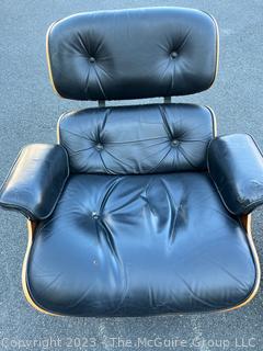 Black Leather Charles and Ray Eames Designed for Herman Miller Lounge Chair & Ottoman.  50th Anniversary Edition.  Wear to leather.  