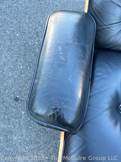 Black Leather Charles and Ray Eames Designed for Herman Miller Lounge Chair & Ottoman.  50th Anniversary Edition.  Wear to leather.  