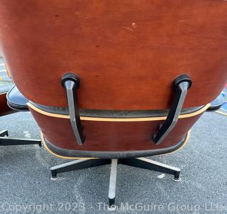 Black Leather Charles and Ray Eames Designed for Herman Miller Lounge Chair & Ottoman.  50th Anniversary Edition.  Wear to leather.  