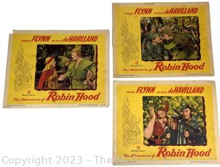 Three (3) 1948 Vintage Lobby Cards from The Adventures of Robin Hood Starring Errol Flynn, Olivia De Havilland, Basil Rathbone and Claude Rains.  11" x 14"