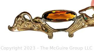 Art Nouveau Brooch with Swans Surrounding Amber Center Stone. 